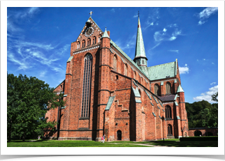 The all red brick church is simply huge!